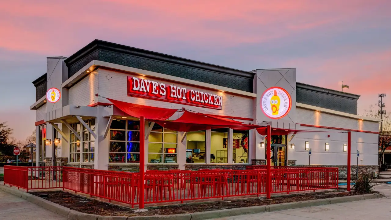 Exterior image of Dave's Hot Chicken restaurant at sunset in Missouri City, Texas.