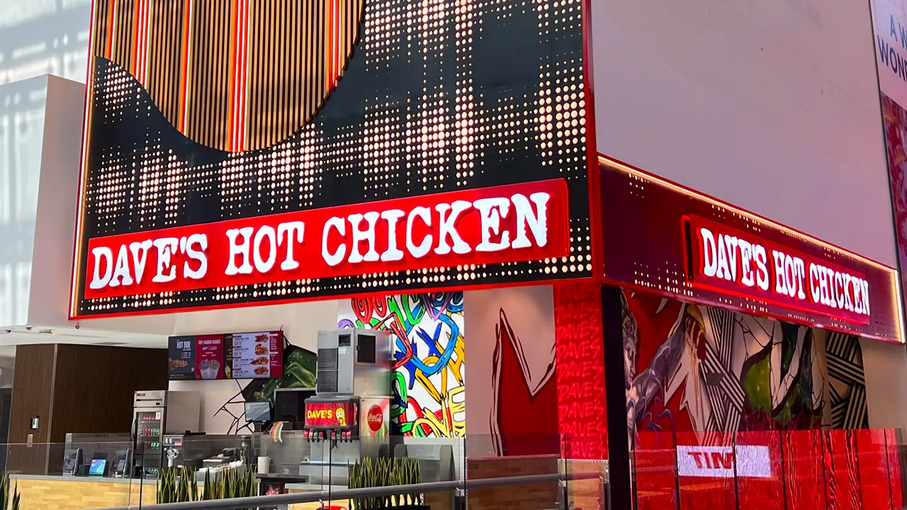 Dave's Hot Chicken with bold signage and exterior murals at Dubai Mall, Dubai, UAE.