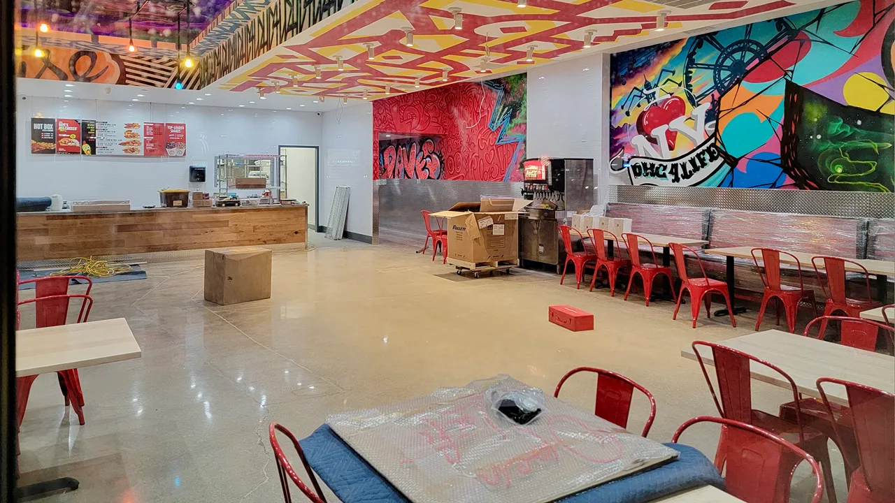 Dave's Hot Chicken Cicero, NY this shot is the interior with murals and graffiti artwork. 2 Boxes on the floor getting ready for their Opening Day.