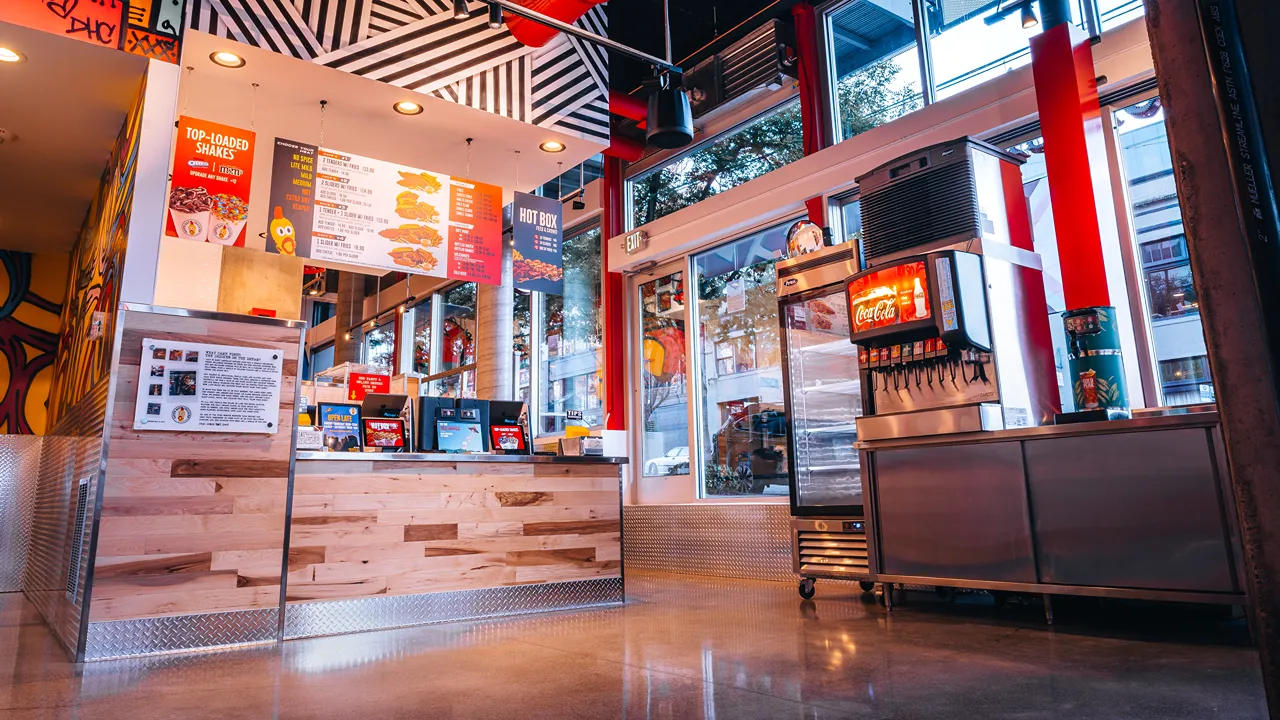 Counter area with menu board and beverage station at Dave's Hot Chicken, E. Pike St, Seattle, WA.