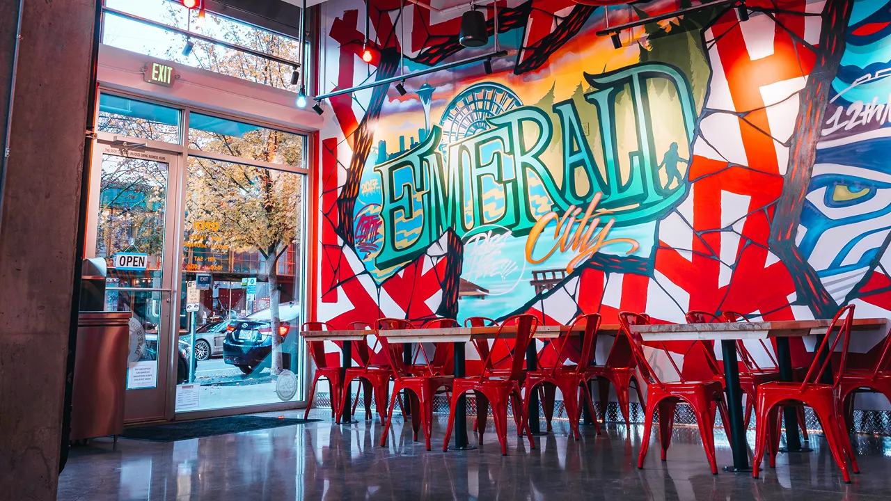 Indoor seating by the window at Dave's Hot Chicken on E. Pike St, Seattle, WA, overlooking the street.