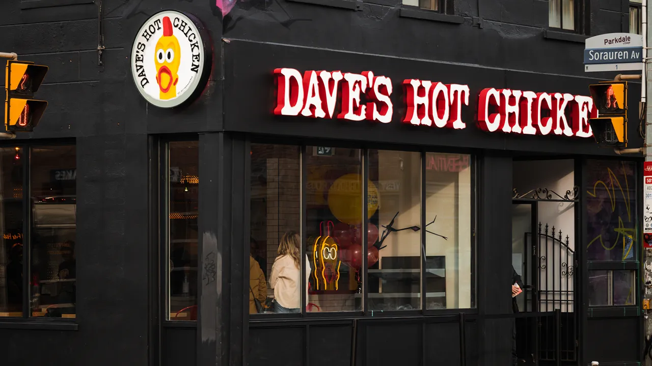 Corner view of Dave's Hot Chicken on Queen St. in the Parkdale district of Toronto, ON.