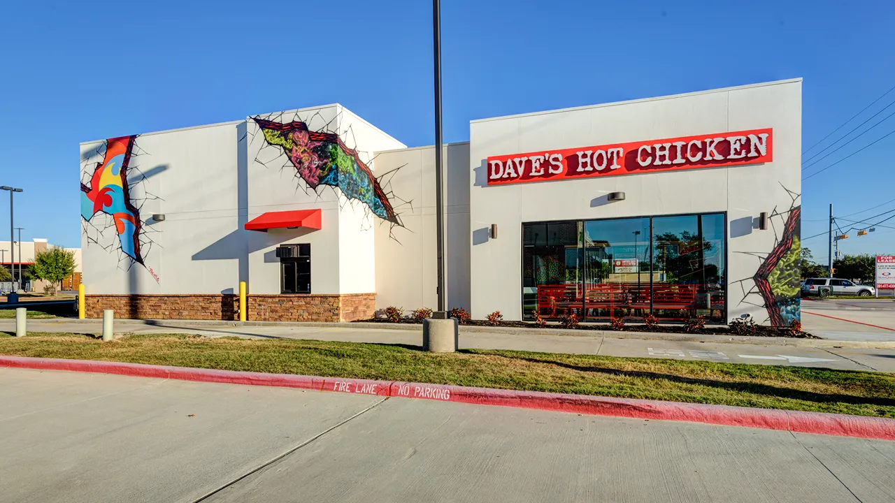 Daytime exterior of Dave's Hot Chicken on Kuykendahl Road, Spring, TX, showing the building and surrounding area.