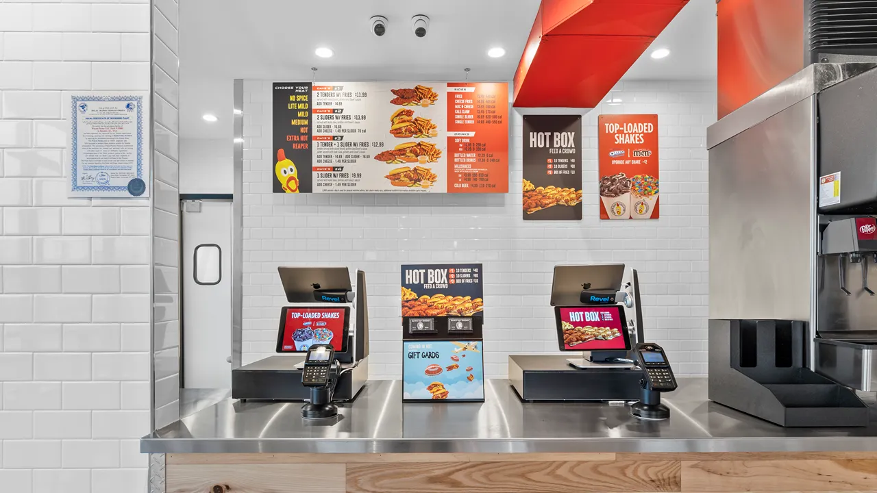 Counter area with Dave’s Hot Chicken menu boards at the Capitol Dr location in Wauwatosa, WI.