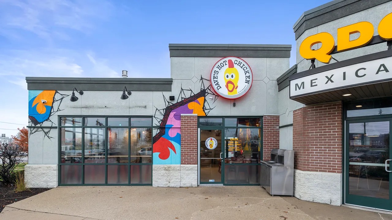 Front exterior of Dave’s Hot Chicken with bright signage at the Capitol Dr location in Wauwatosa, WI.