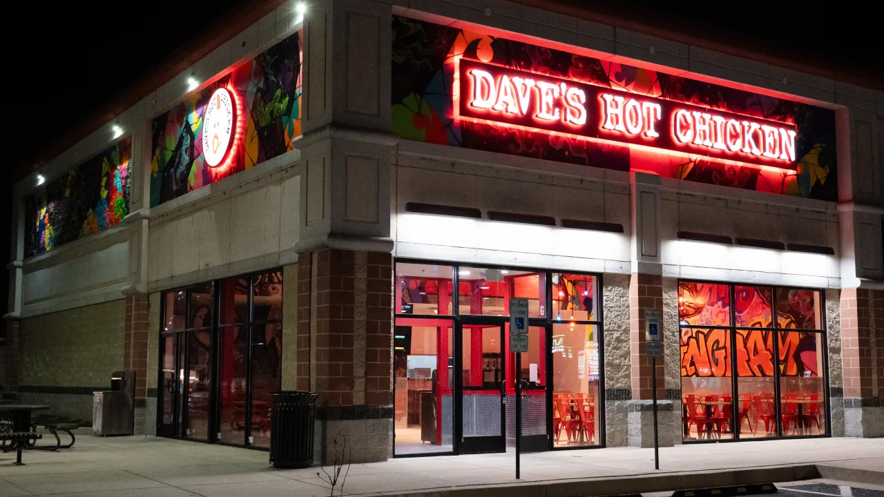 Exterior view of Dave's Hot Chicken on Campbell Blvd, Nottingham, MD, featuring vibrant signage and colorful murals.
